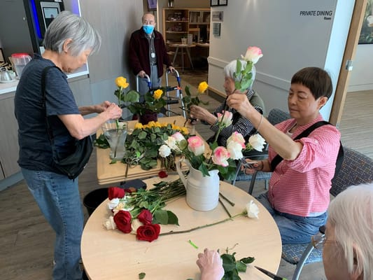 Residents engaging in flower arranging activity