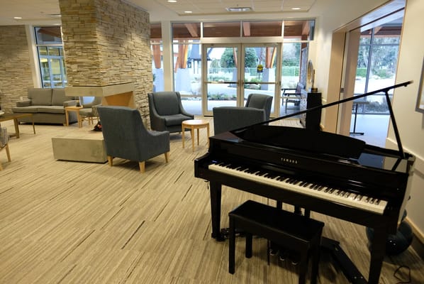 Interior view of a lounge area with a piano