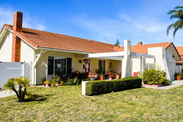 Exterior view of a residential facility with a garden