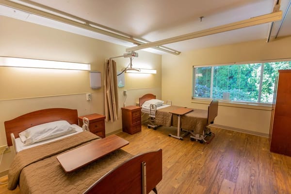 Shared private room with medical equipment and furniture
