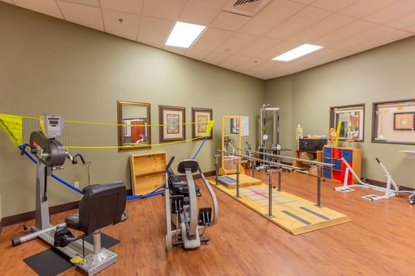 Physical therapy gym with exercise equipment
