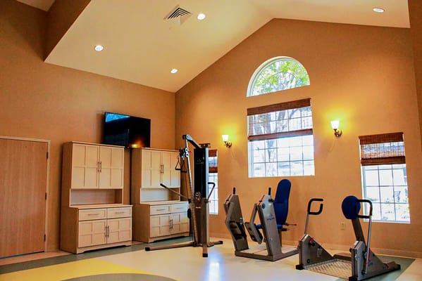 Interior view of a fitness room with exercise equipment