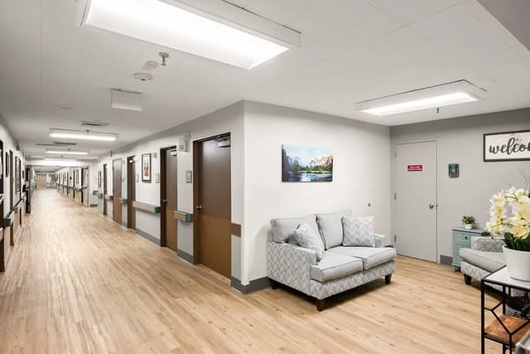 Interior hallway with seating and artwork