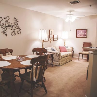 Cozy interior common area with a dining table and seating