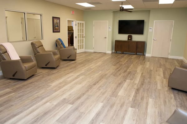 Common area with reclining chairs and TV