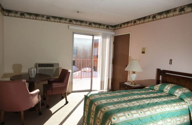 Private resident room with bed and seating area