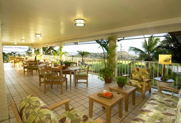 Outdoor patio area with seating and plants