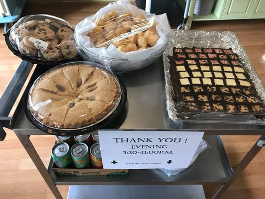 Dessert cart with cookies, pastries, and treats