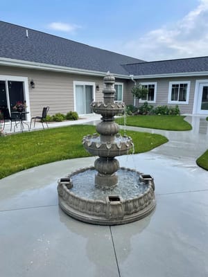 A beautiful outdoor fountain in a garden area