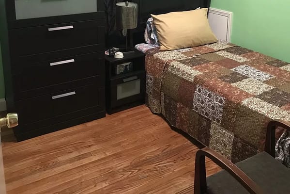 Cozy resident room with a bed and furniture