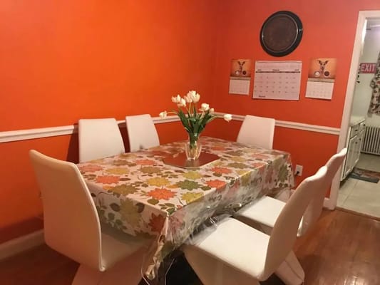 Cozy dining room with a table set for meals