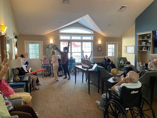 Residents participating in an engaging activity in a common area