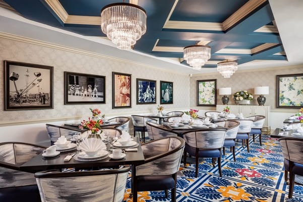 Elegant dining room set for a meal with floral arrangements