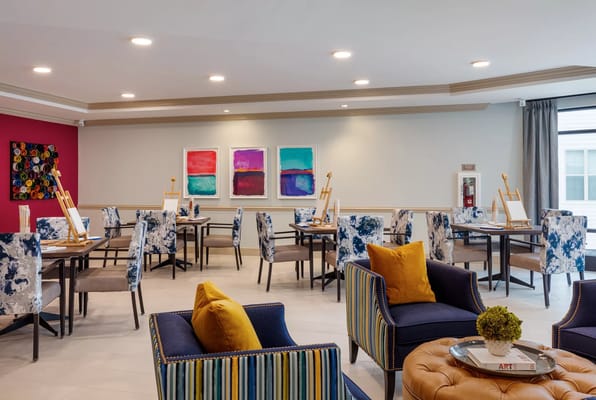 Bright activity room with art supplies and seating