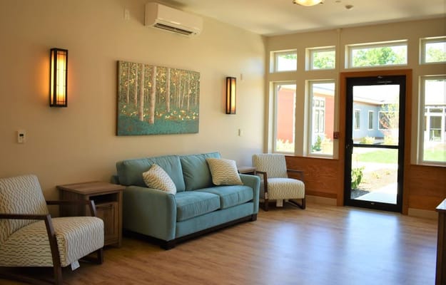 Interior view of a common area with seating and artwork