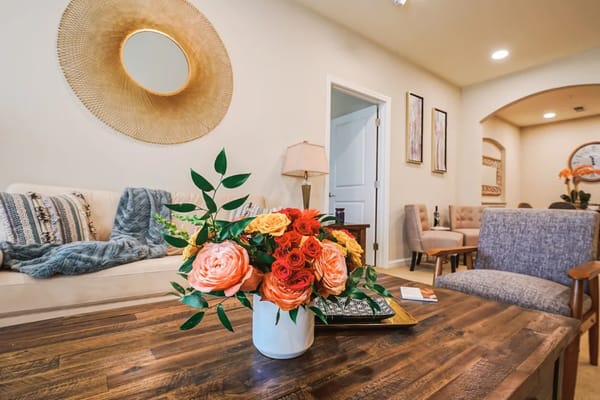 Cozy interior space with floral arrangement and seating