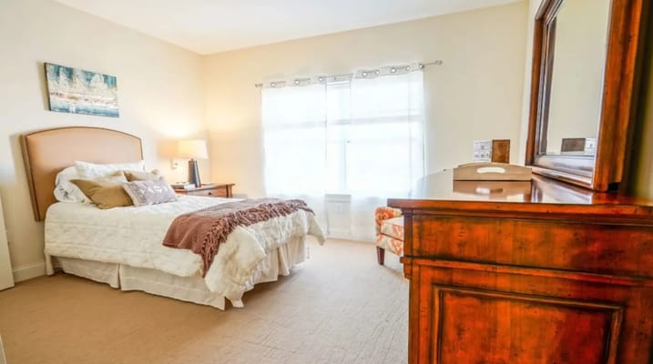 Cozy interior of a private resident room with a bed and decor
