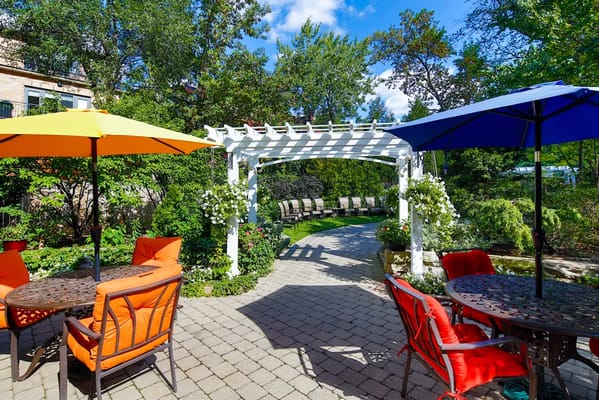 Outdoor patio area with colorful umbrellas and seating
