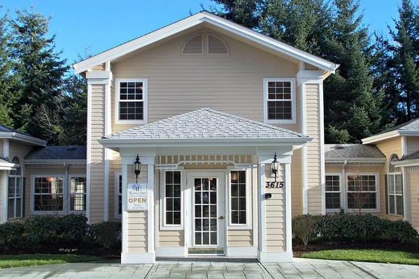 Front entrance of Hearthside Manor Memory Care with open sign