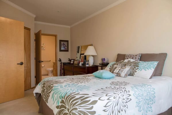 Cozy bedroom interior with floral bedding