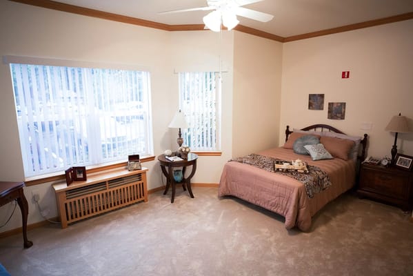 Cozy resident room with a bed and natural light