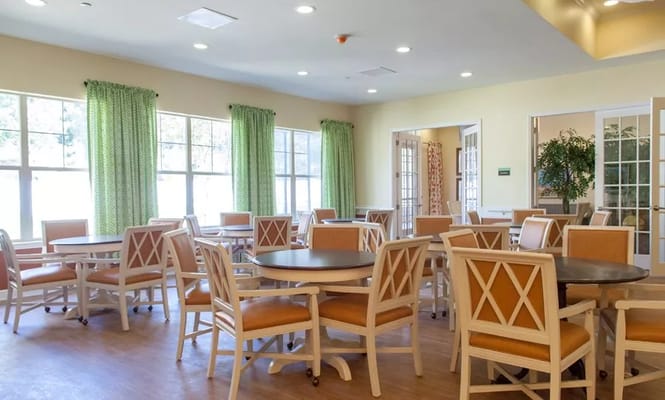 Bright dining room with wooden tables and chairs