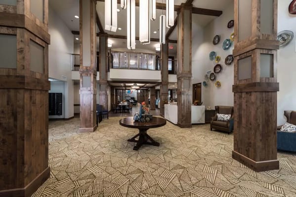 Bright interior common area with tall ceilings