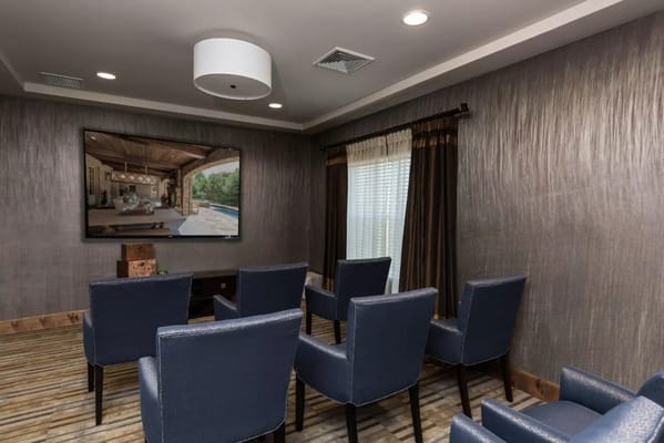 A common area with seating and a large television