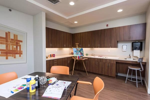 Colorful activity room with art supplies