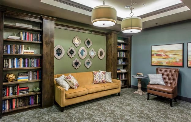 Cozy common area with bookshelves and seating