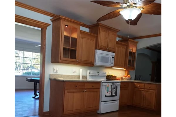 Bright kitchen with wooden cabinets and lighting