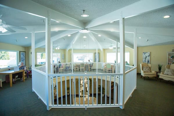Bright interior common area with seating and decor