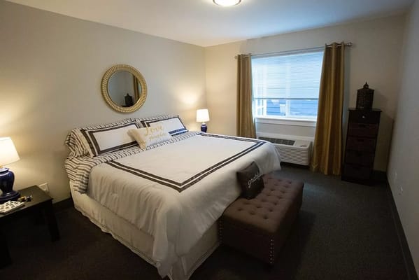 Cozy interior of a private resident room with a bed