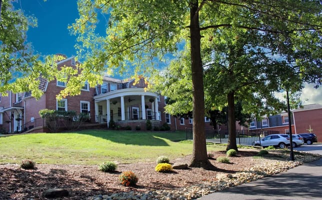 Exterior view of the assisted living facility surrounded by trees