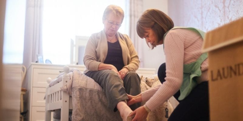 Staff assisting a resident with personal care