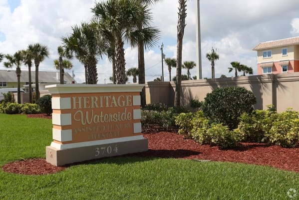 Exterior view of the Heritage Waterside sign and landscaping