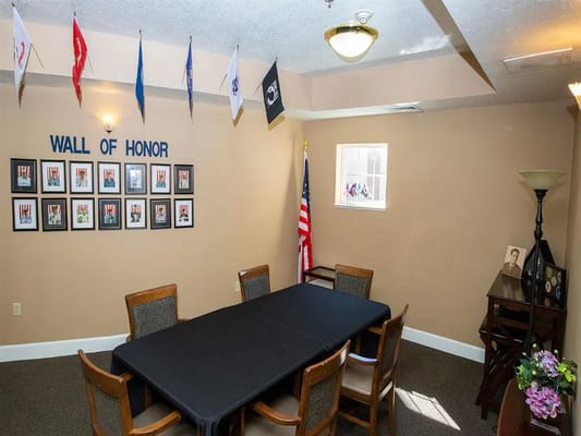 Interior view of a memorial room with honors display