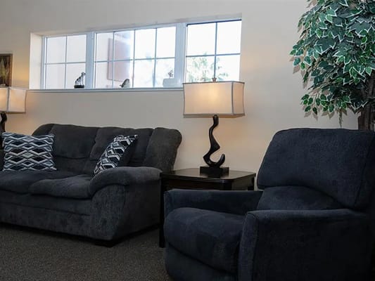 Cozy interior seating area with couches and lamps