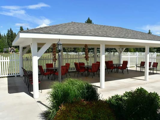 Outdoor seating area with tables and chairs