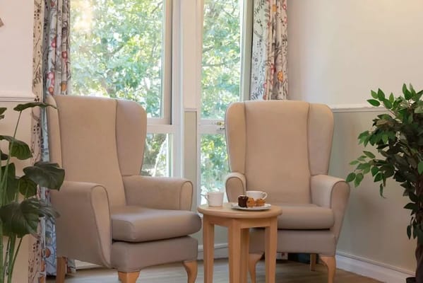 Cozy common area with comfortable armchairs and natural light