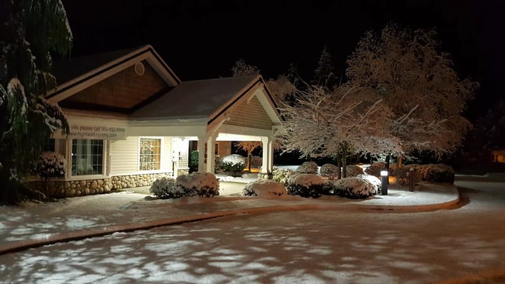 Front entrance of Highland Court Memory Care covered in snow