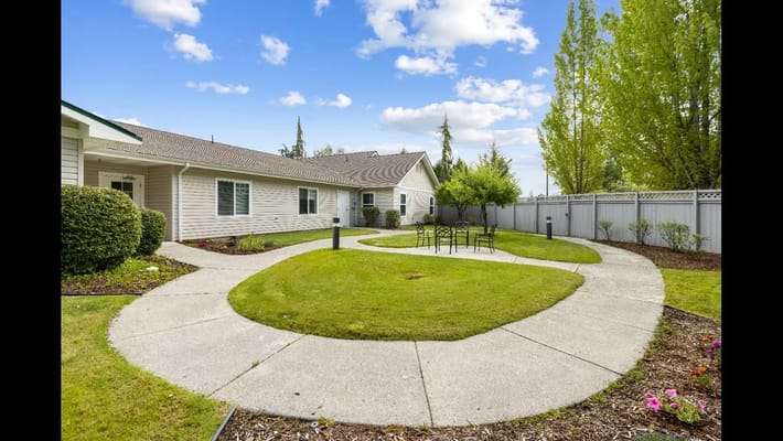 Well-maintained outdoor space with walking paths and seating
