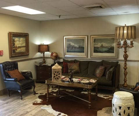 Cozy common area with comfortable seating and artwork