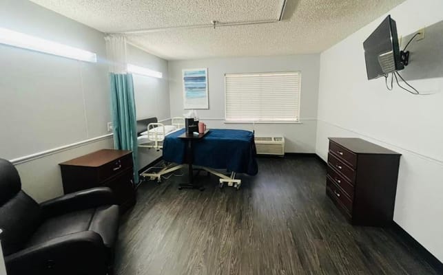 Private resident room with medical bed and furniture