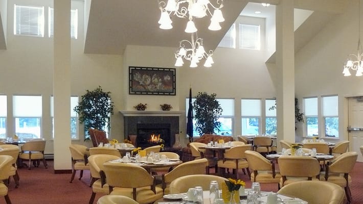 Bright dining room with tables set for meals