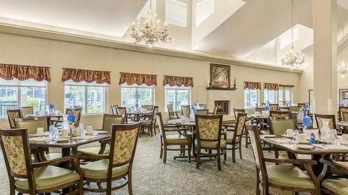 Bright dining room with tables set for a meal