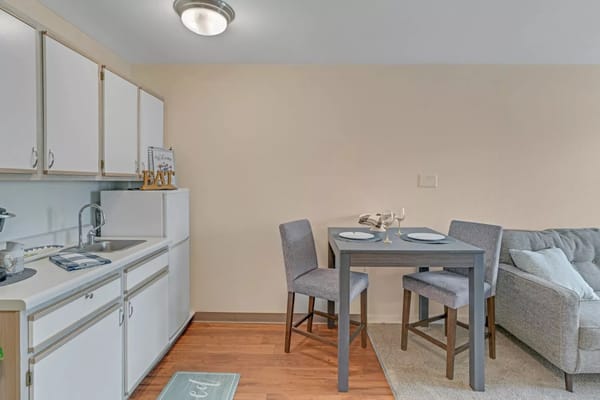 Cozy dining area with a small table and chairs