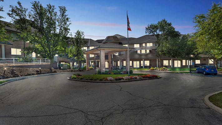 Front entrance of Holiday Beaverdale Estates with landscaping