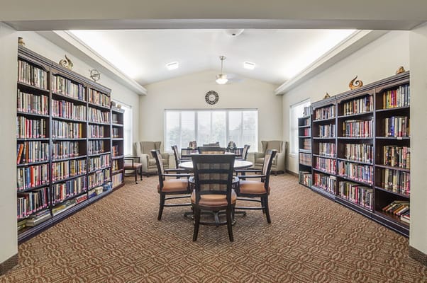 Cozy library with bookshelves and seating area