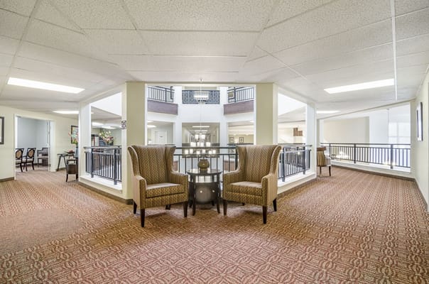 Seating area with two armchairs and a small table in a lobby